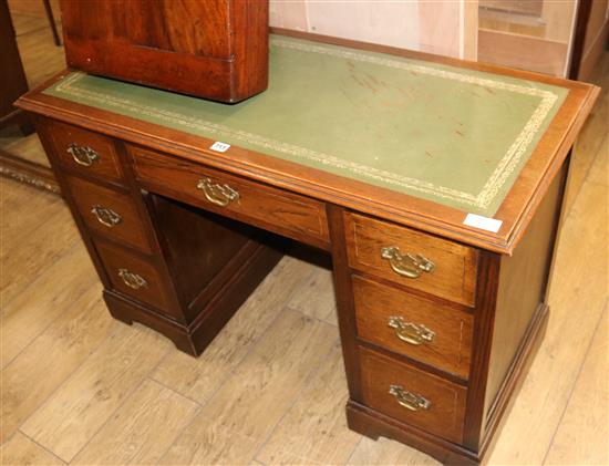 An Edwardian inlaid oak desk, W.110cm